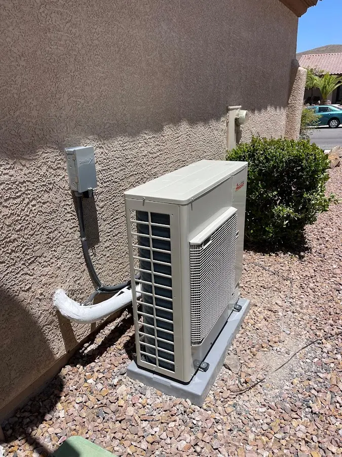 Residential air conditioning condenser unit in Braidwood